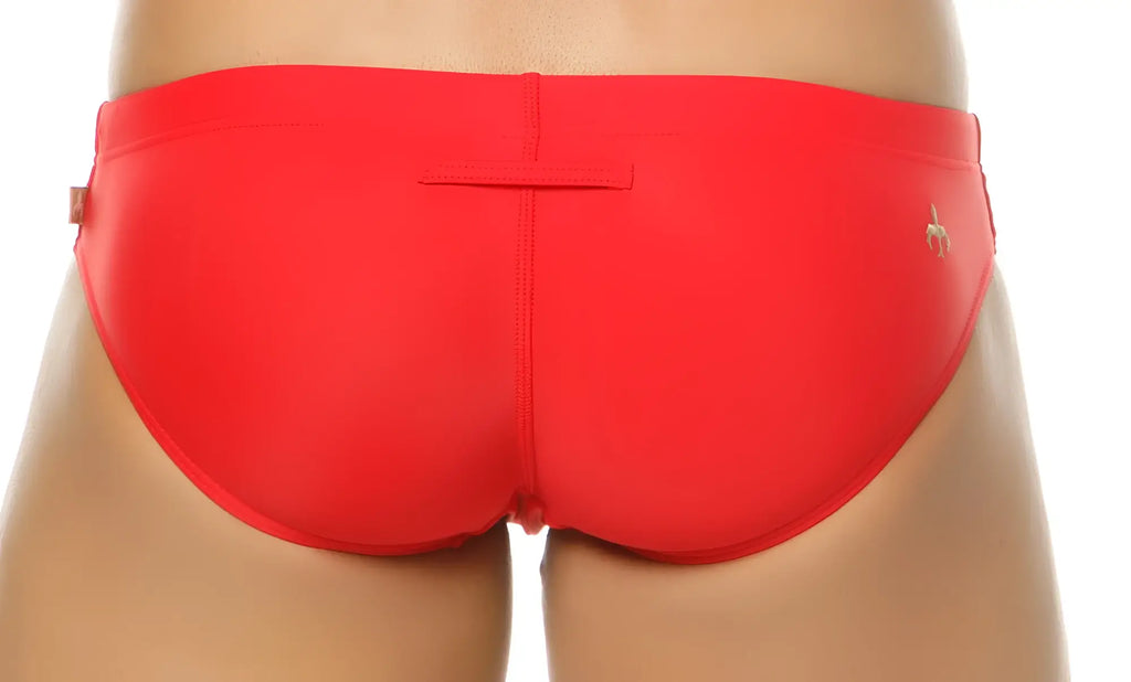 Bright red marcuse patrol bikini swimwear with sleek form-fitting design and small gold logo on the side