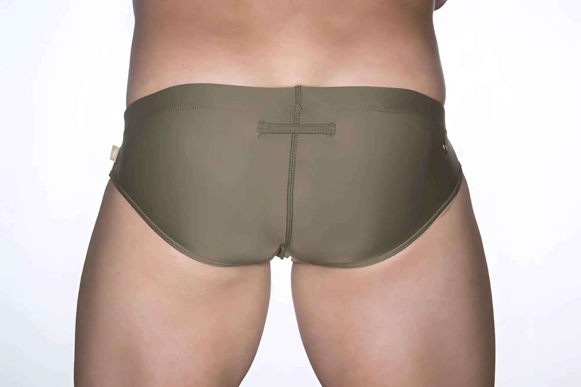 Back view of olive green marcuse patrol bikini swimwear trunks with stitched cross detail for swimming and beachwear
