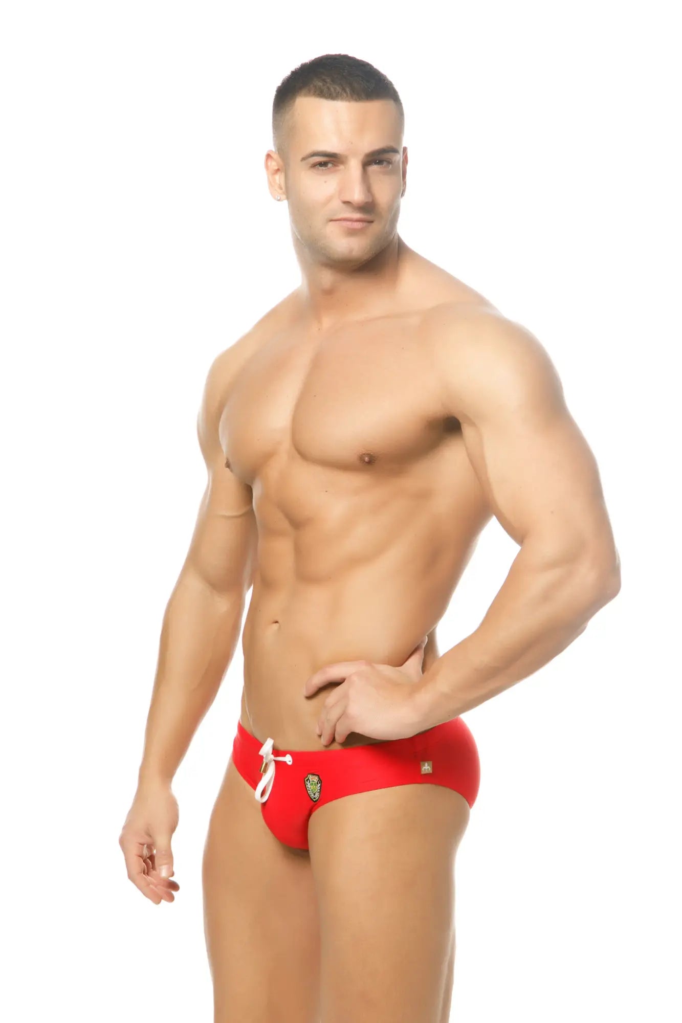 Red marcuse patrol bikini swimwear trunks with white drawstrings and a small gold logo on the side