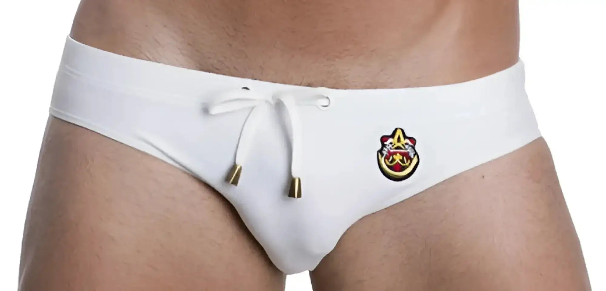 White men’s marcuse patrol bikini swimwear trunks with gold drawstring and front embroidered logo