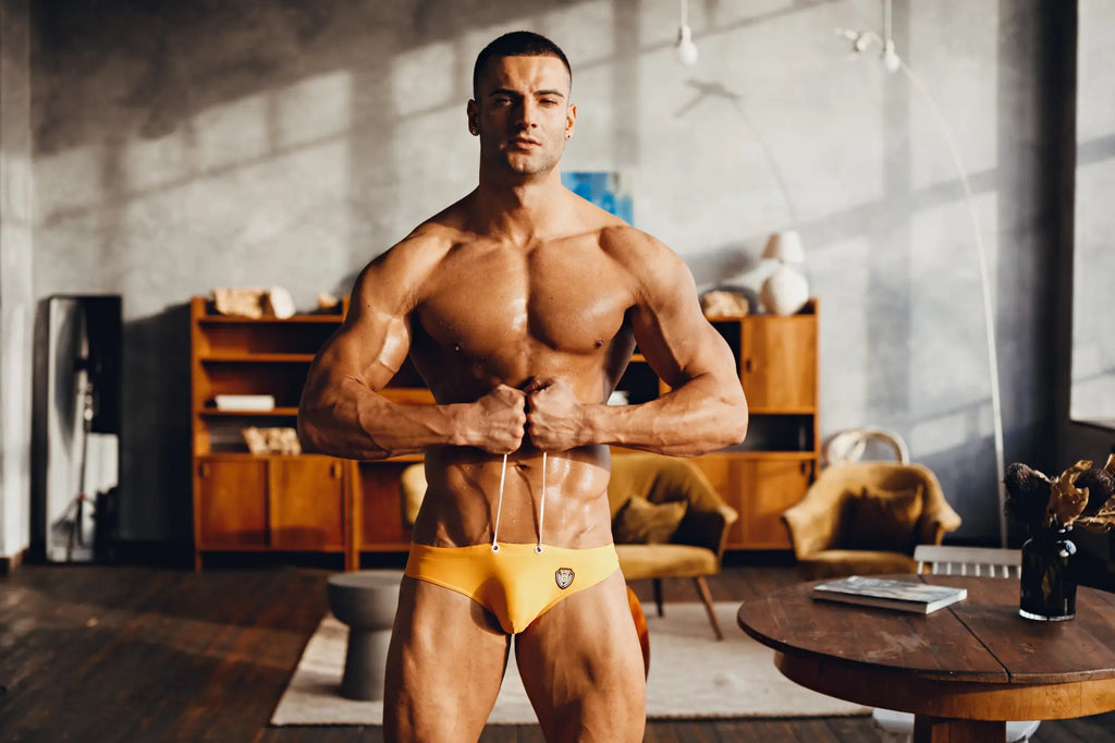 Yellow marcuse patrol bikini swimwear briefs with small embroidered logo designed for athletic use