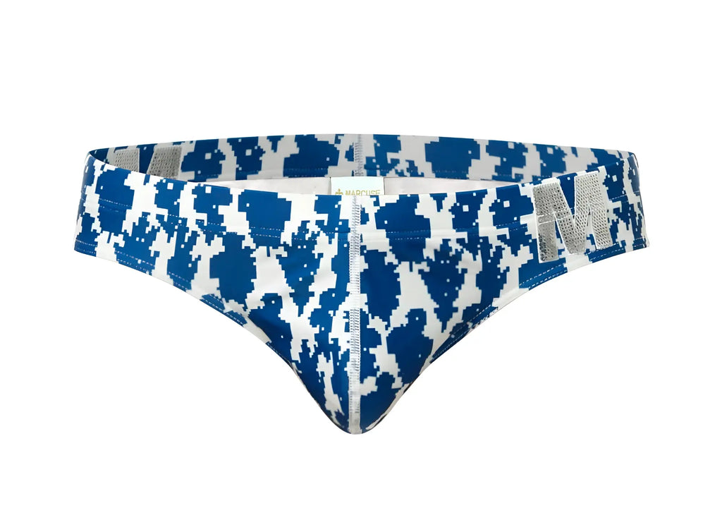 Marcuse Phraya brief swimwear in blue and white pixelated pattern with silver m logo on the side