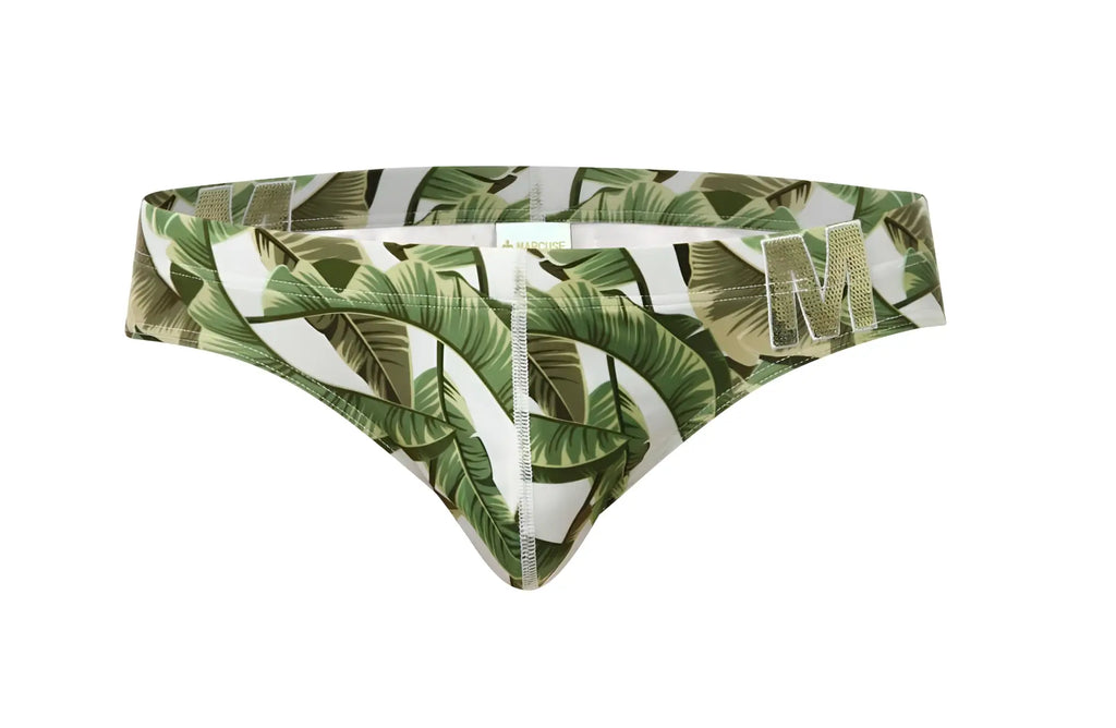 Marcuse Phraya brief swimwear with green and white tropical leaf pattern and metallic gold m logo on the side