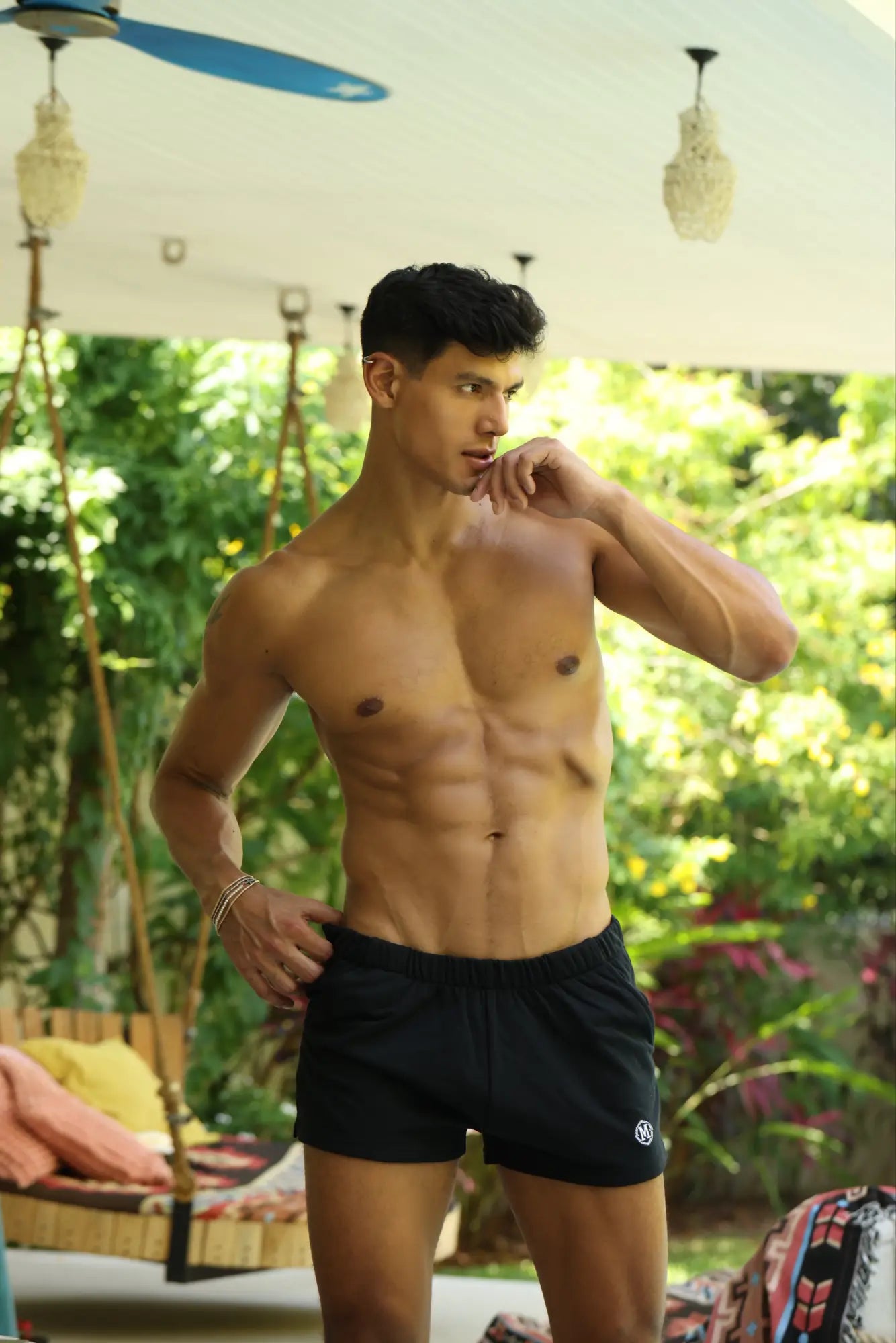 Marcuse physical shorts in black athletic fabric with a small white logo on the lower left leg for workouts