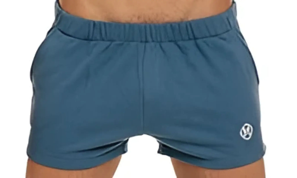 Blue marcuse physical athletic shorts with a small white logo on the lower left leg for workout use