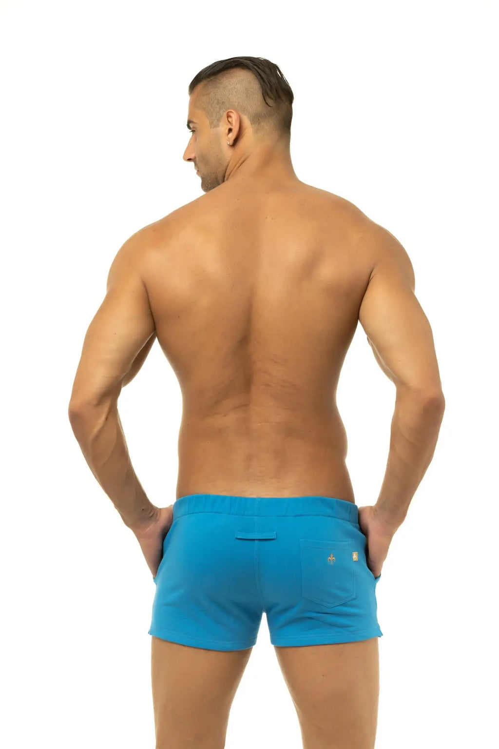 Back side of bright blue marcuse physical shorts with sleek modern design and subtle branding on the pocket