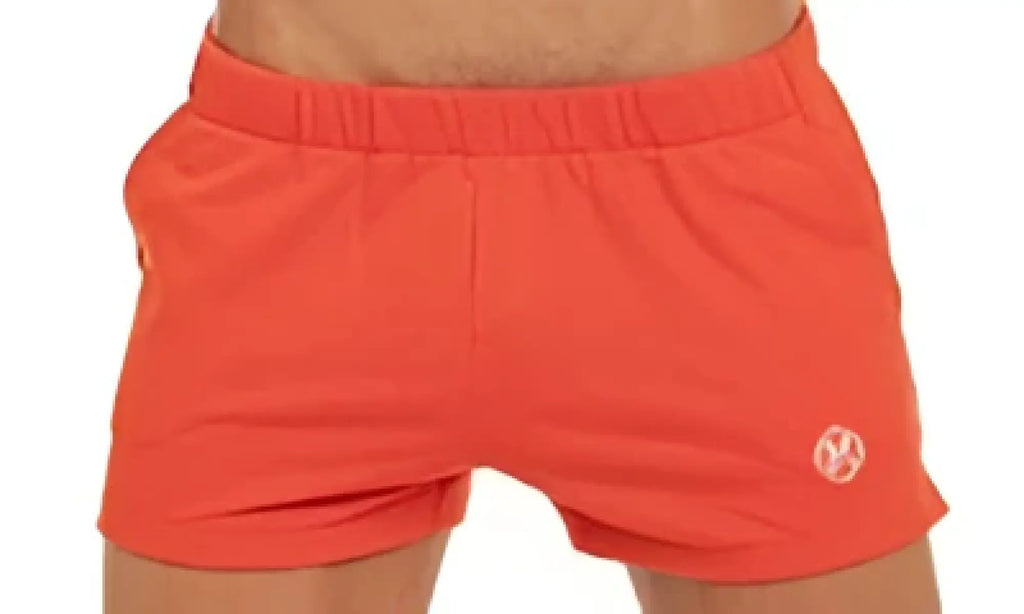 Marcuse physical shorts bright orange athletic shorts with snug elastic waistband and small circular logo on lower left leg