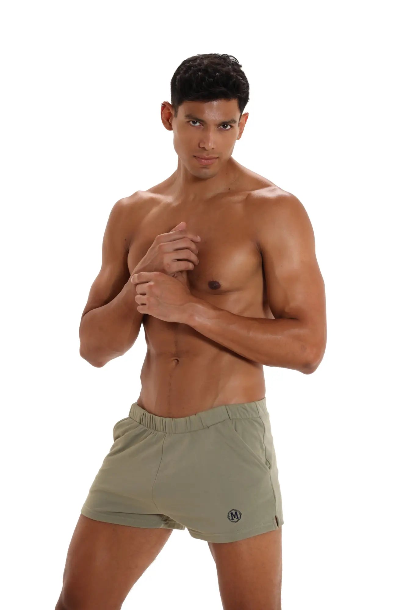 Olive green marcuse physical athletic shorts with small circular logo on lower right leg designed for training
