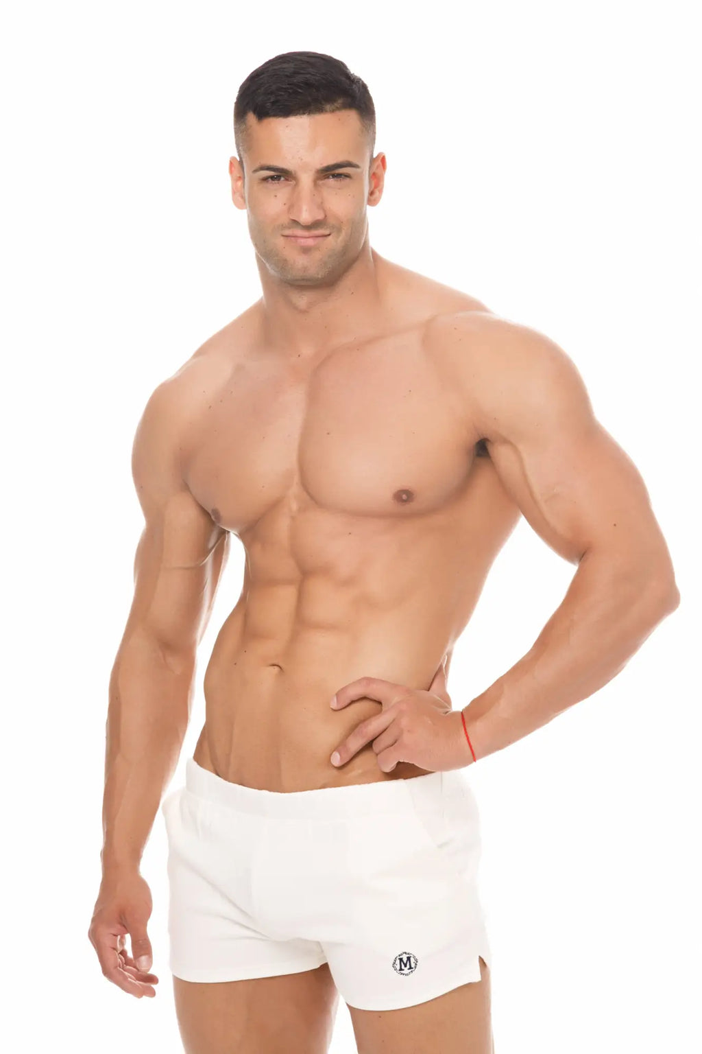 White marcuse physical athletic shorts with small black logo on lower left leg made for active use