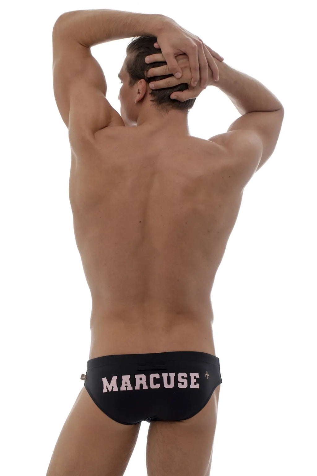 Black Marcuse swim trunks with pink lettering from Marcuse Proud Bikini Swimwear for stylish beachwear