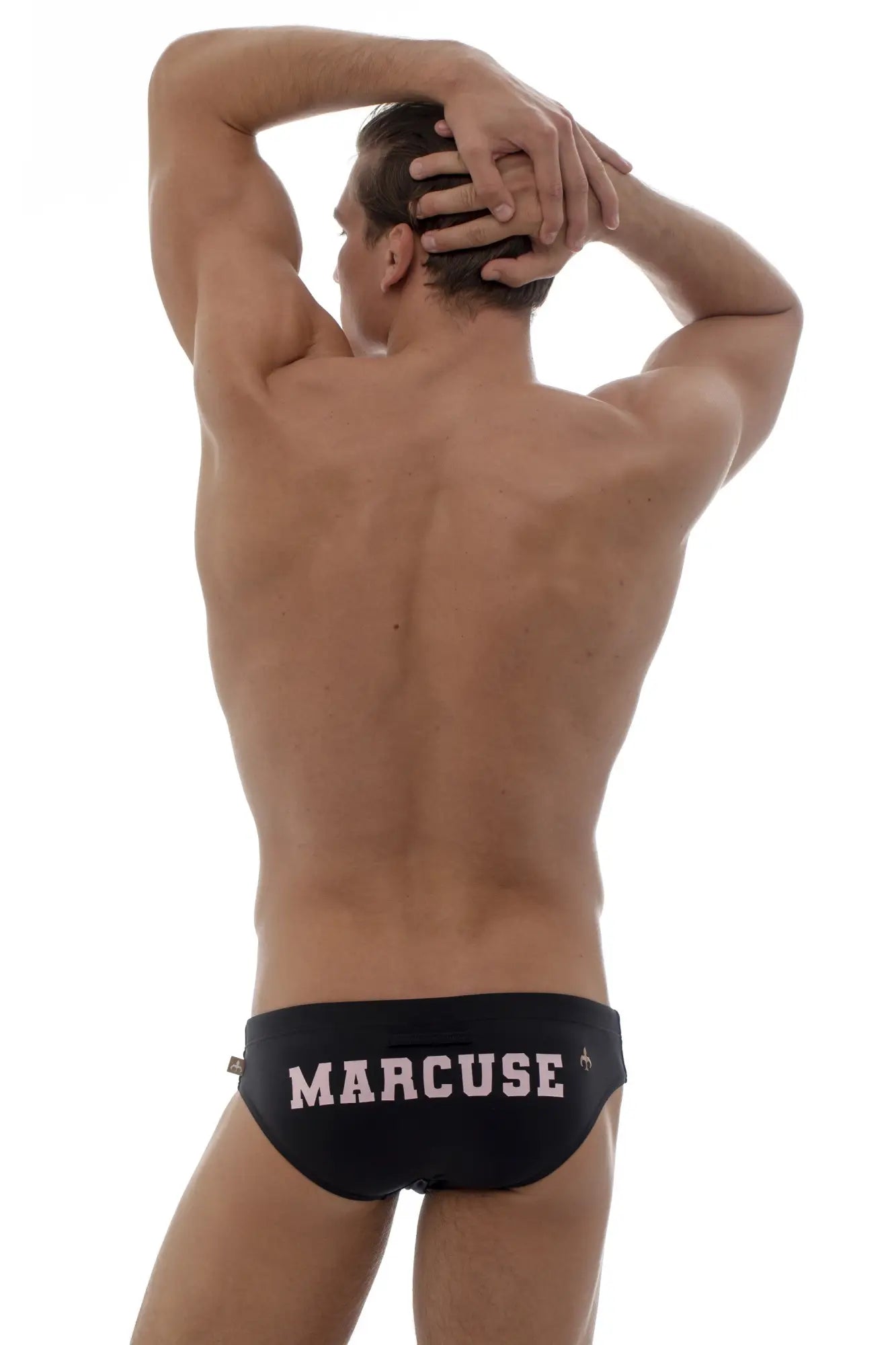 Black Marcuse swim trunks with pink lettering from Marcuse Proud Bikini Swimwear for stylish beachwear