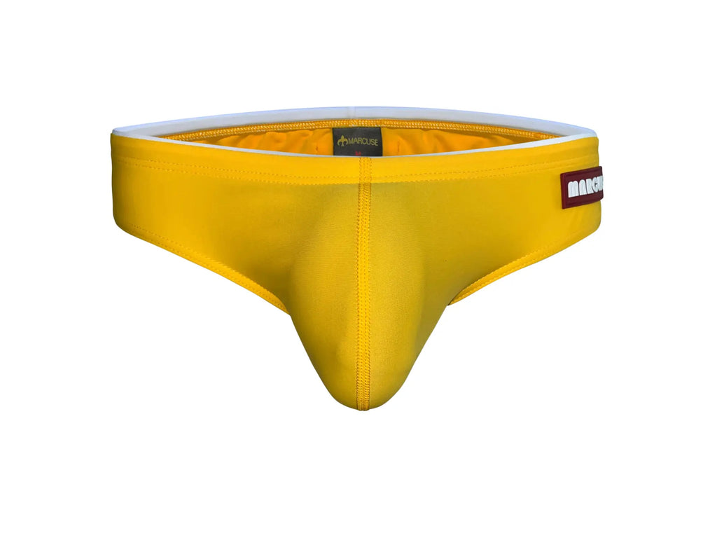 Marcuse Sandboy bikini swimwear bright yellow form-fitting men’s briefs with white elastic waistband and red brand label