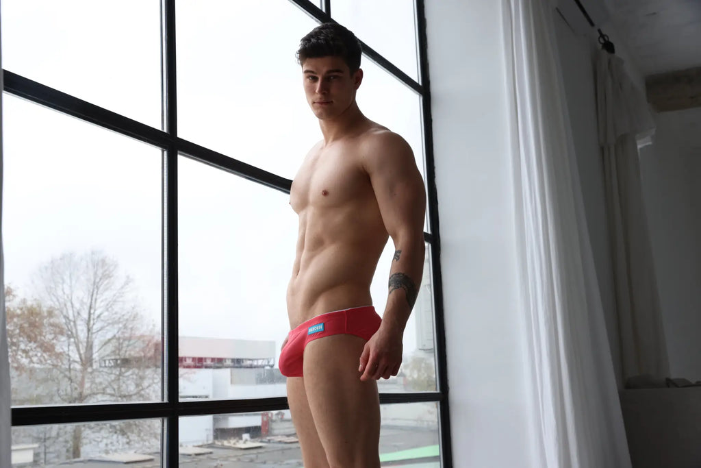 Marcuse Sandboy bikini swimwear red briefs with blue logo on waistband front view