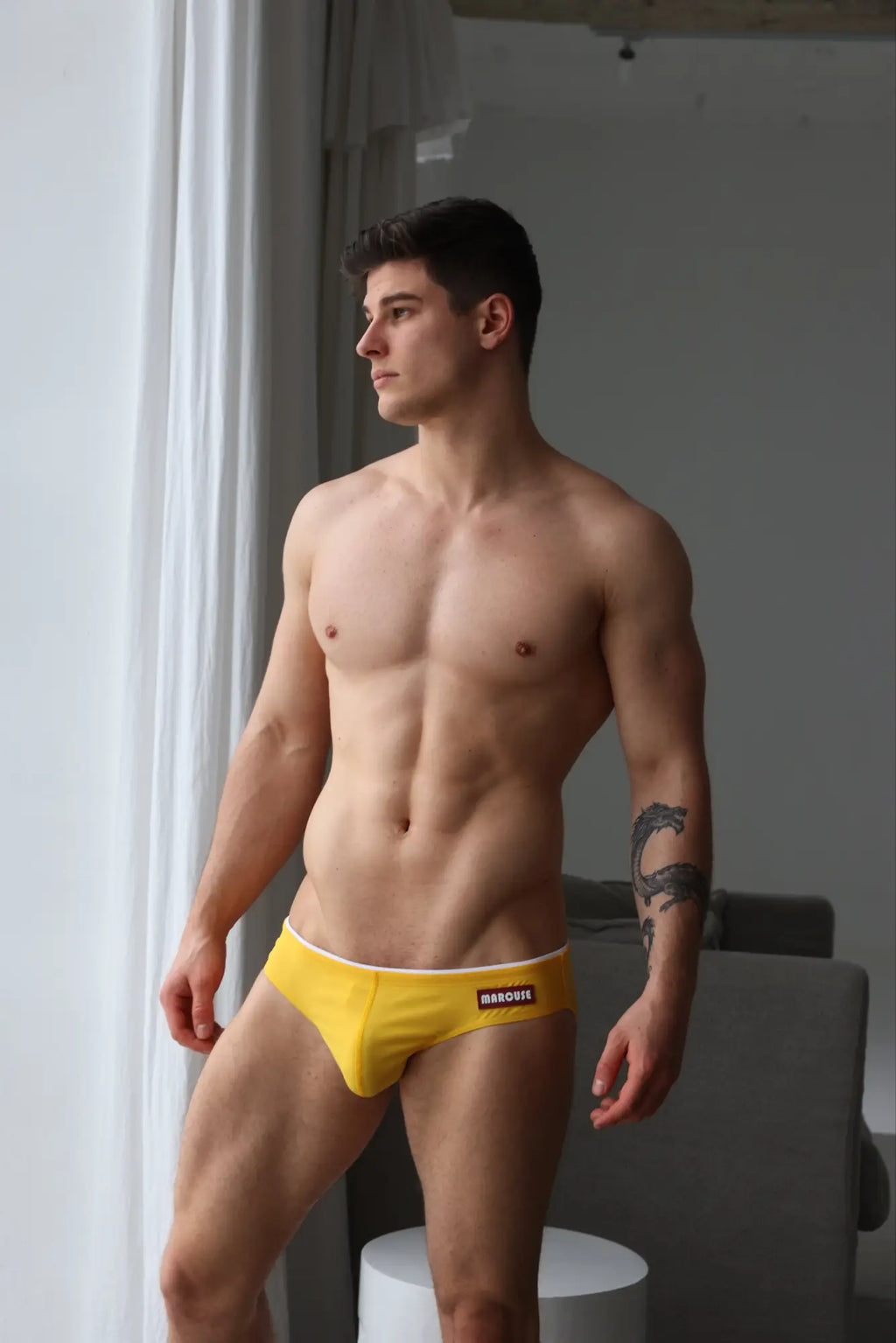 Yellow marcuse sandboy bikini swimwear briefs with white waistband and black branding ideal for swimming