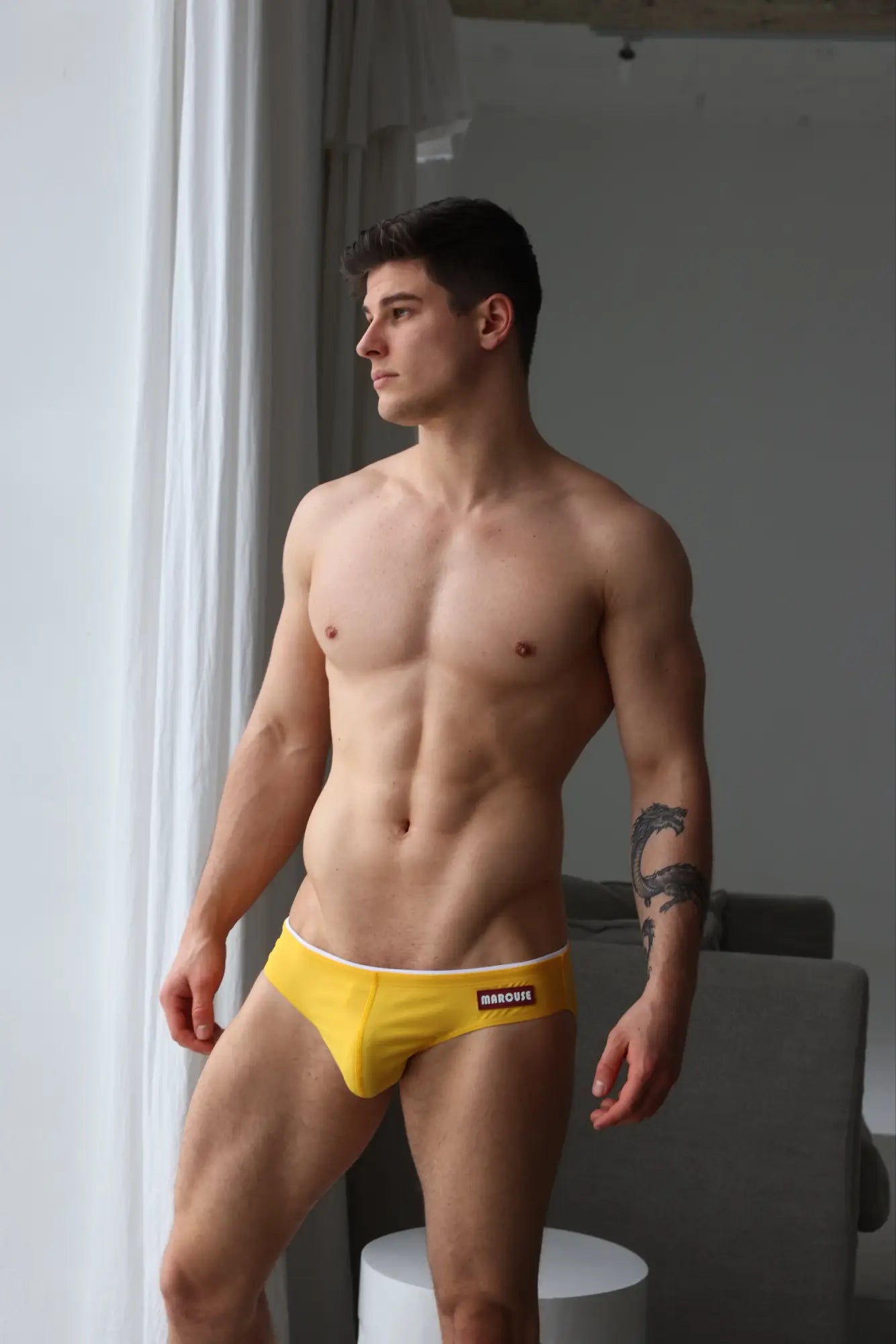 Yellow marcuse sandboy bikini swimwear briefs with white waistband and black branding ideal for swimming