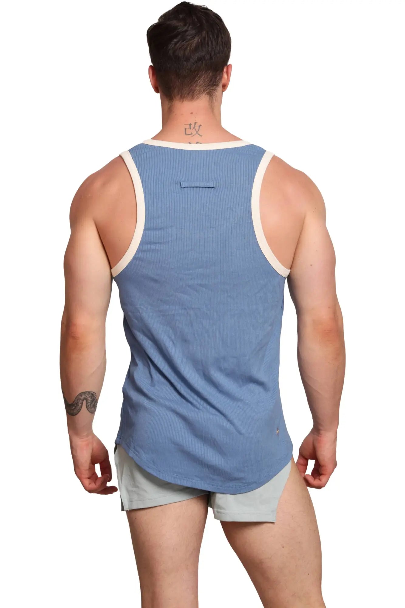 Blue ribbed Marcuse sexercise tank top with cream-colored trim designed for workout and casual wear