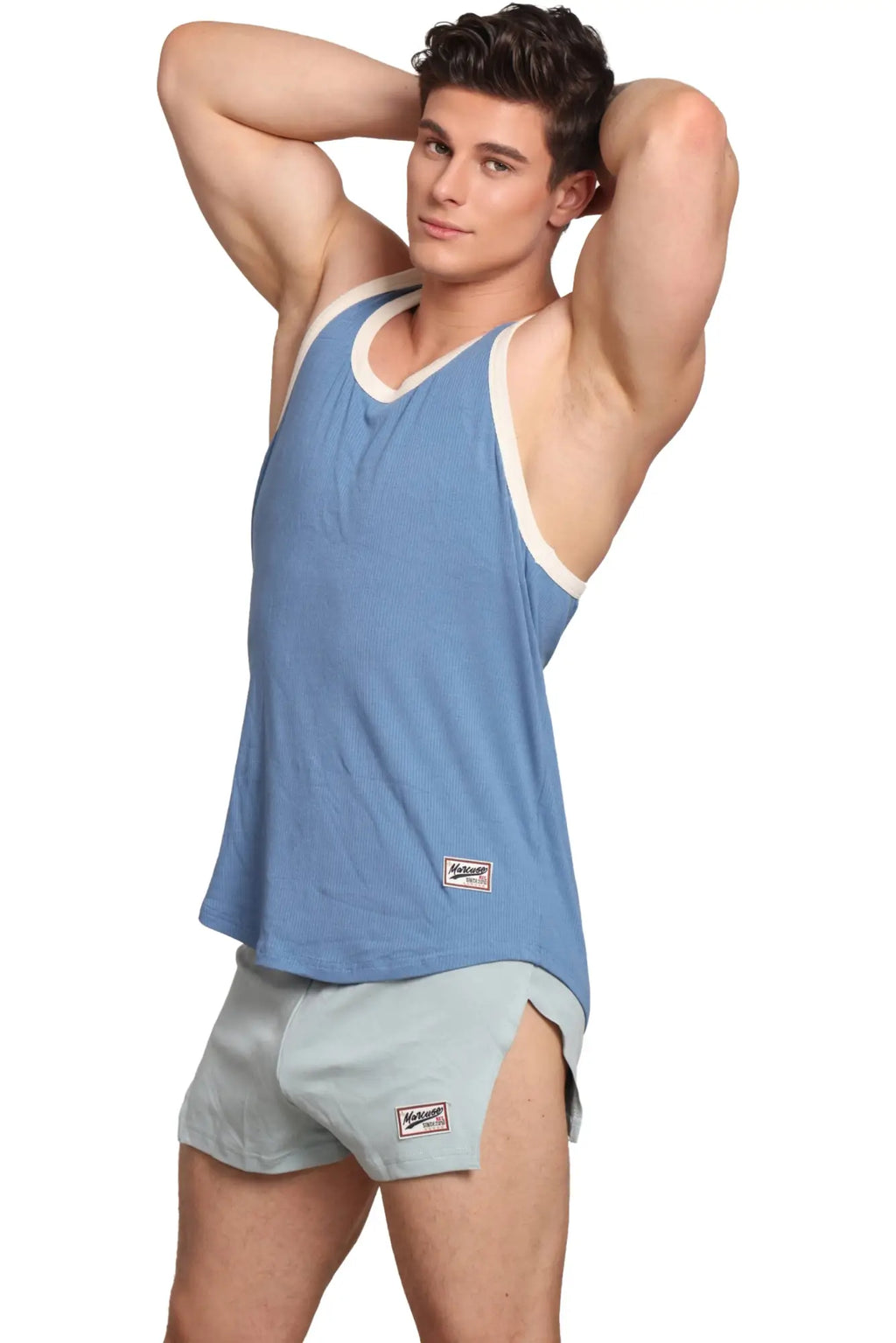 Light blue ribbed Marcuse Sexercise tank top with white trim and a small brand patch on the lower left side