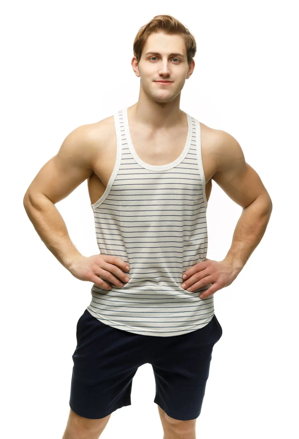 A man wearing a marcuse somer tank top in white and gray thin horizontal stripes made of breathable fabric