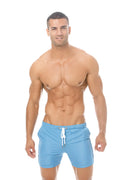 Light blue Marcuse Spectrum swim trunks with white drawstring designed for comfortable beachwear