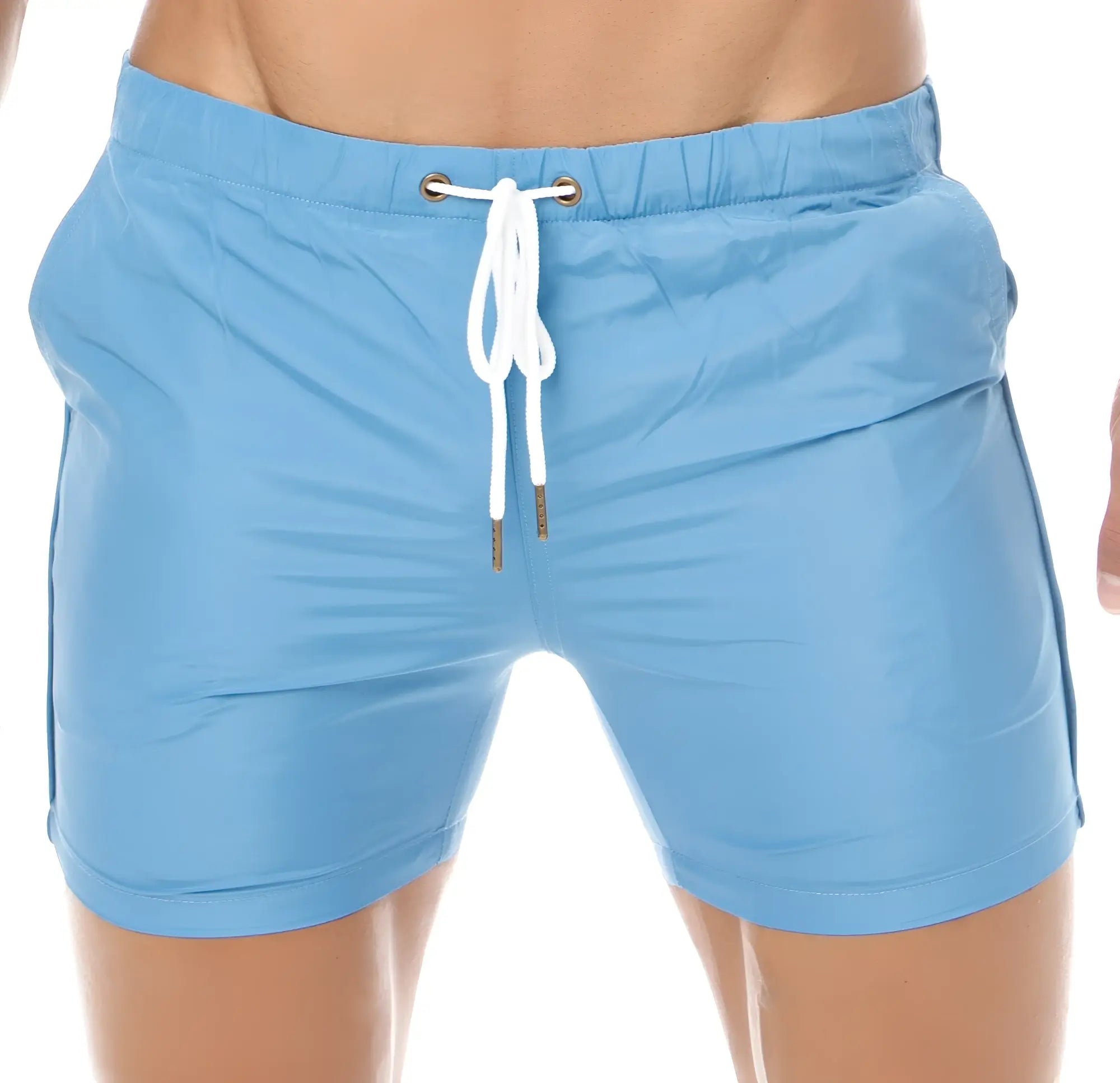 Light blue Marcuse Spectrum shorts with white drawstring and metallic eyelets for swim and beachwear