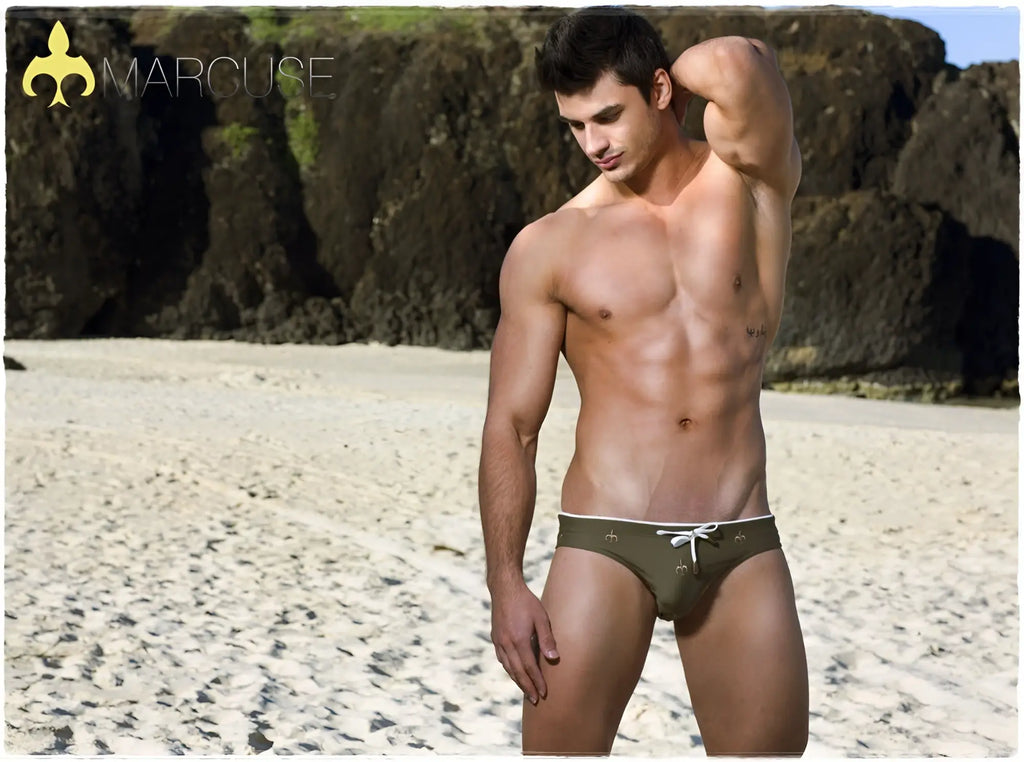 Marcuse Starz bikini swimwear olive green men’s swim shorts with white drawstring and small decorative patterns