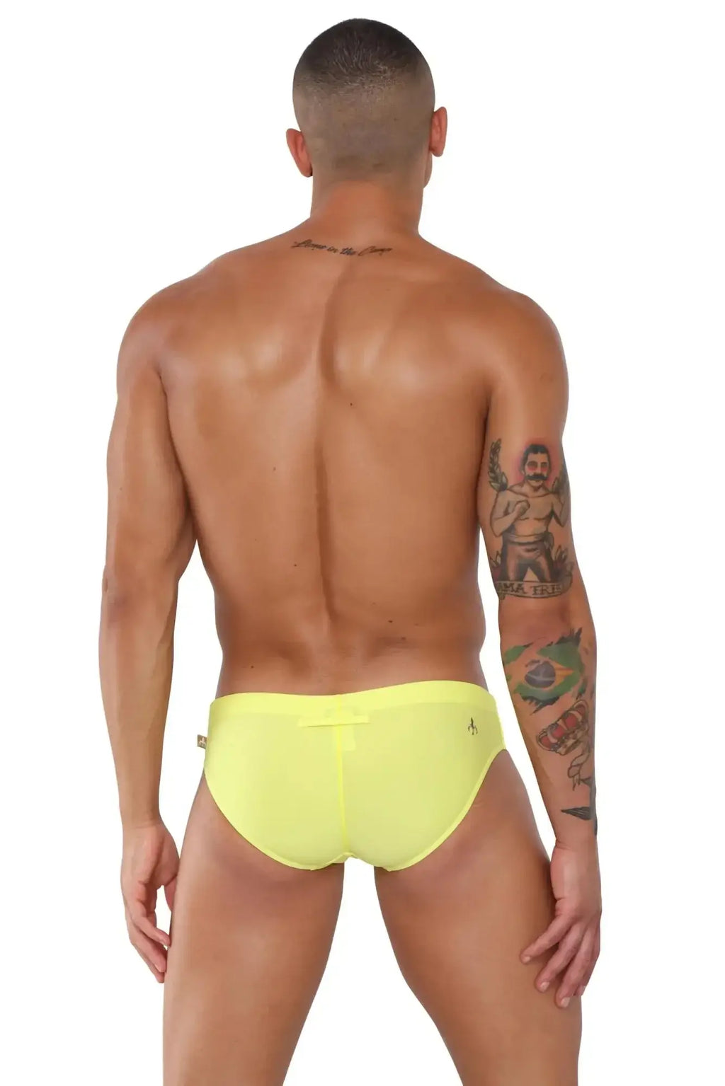 Bright yellow marcuse summery bikini swimwear swim trunks with a small logo on the side for summer beach use