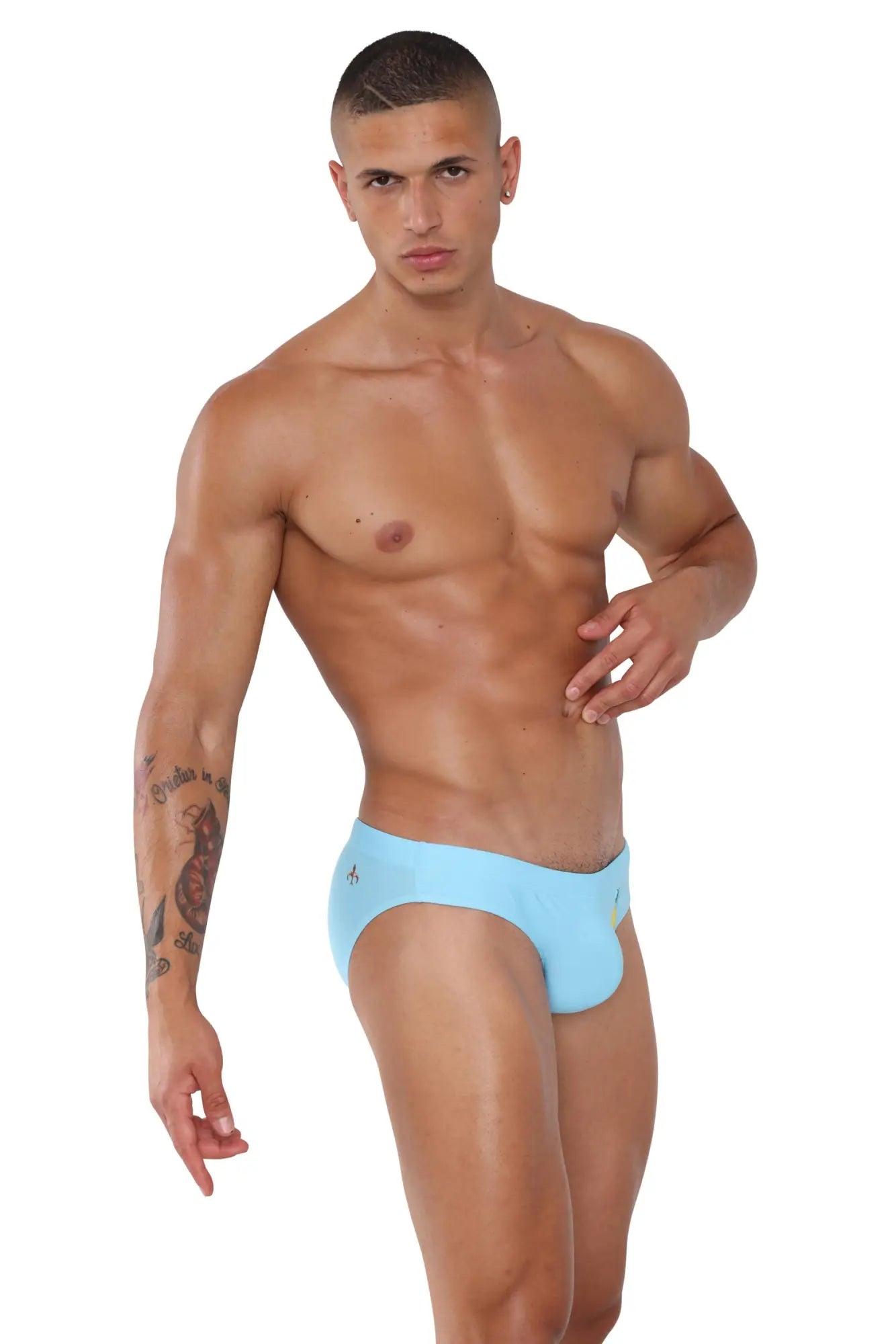 Light blue form-fitting marcuse summery bikini swimwear briefs with a subtle logo on the side