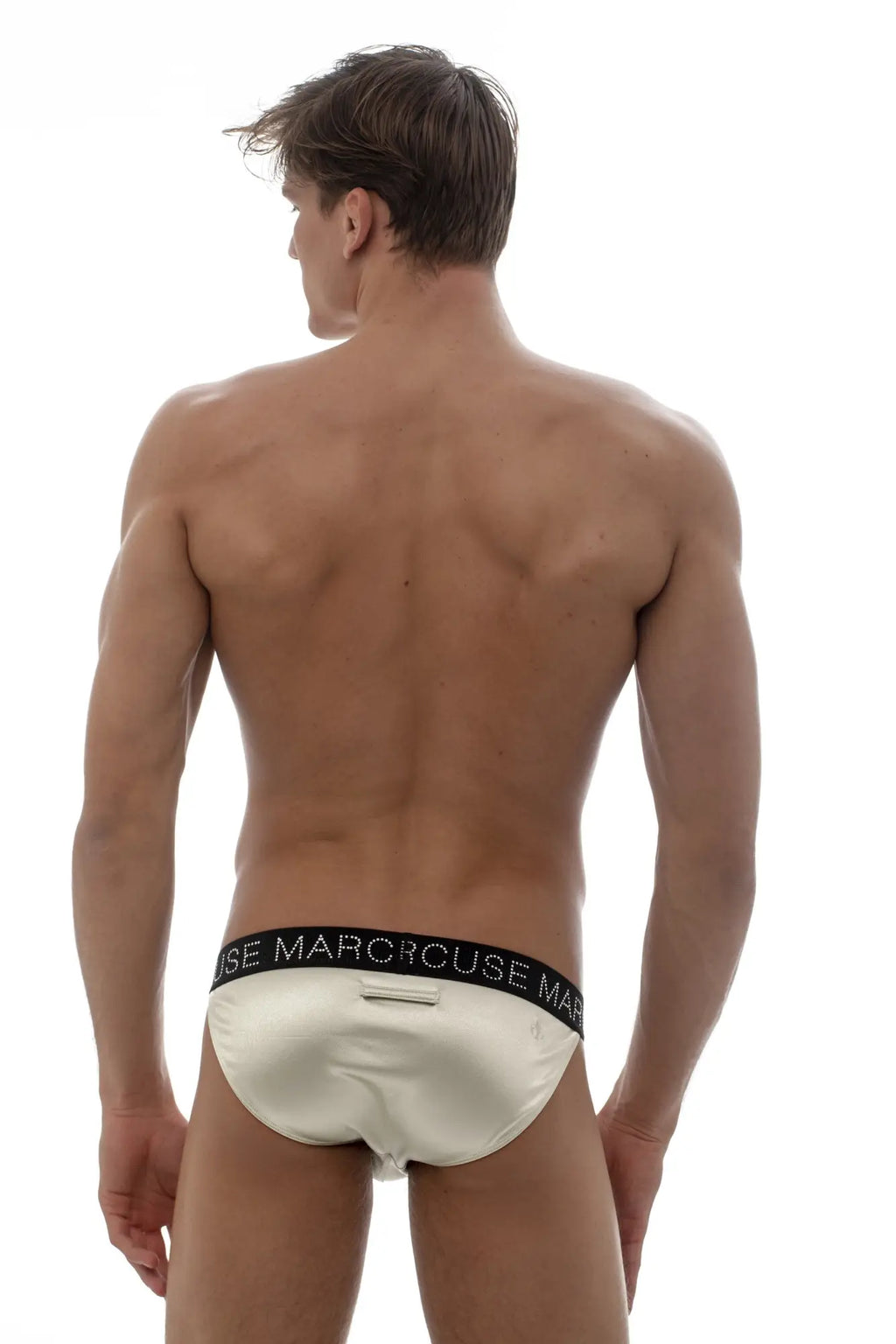 Cream-colored satin marcuse superstar brief underwear with black elastic waistband and white marorouse branding