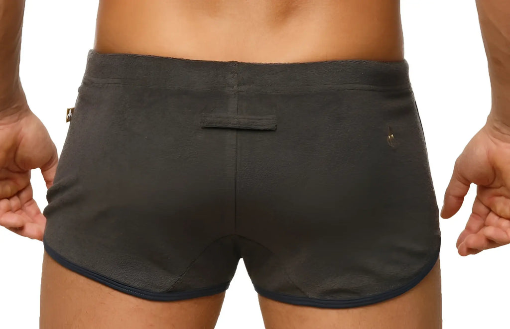 Marcuse sweat shorts dark gray athletic shorts with navy blue trim and small logo on waistband