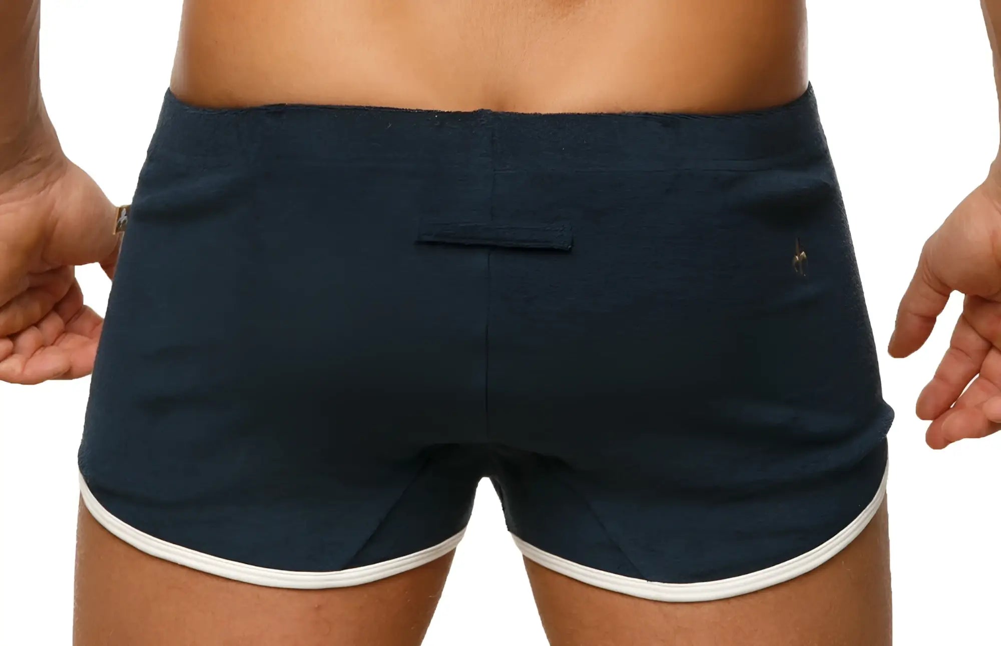 Back side view of navy blue Marcuse sweat shorts with white trim and a small logo on the back pocket