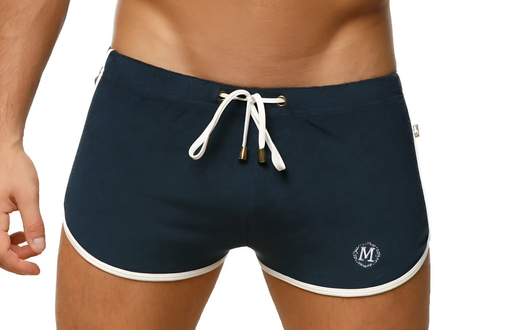Navy blue Marcuse sweat shorts with white trim and drawstring designed for athletic and casual wear