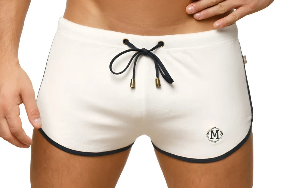 Marcuse sweat shorts in white athletic fabric with black trim drawstring and small embroidered logo on lower left leg