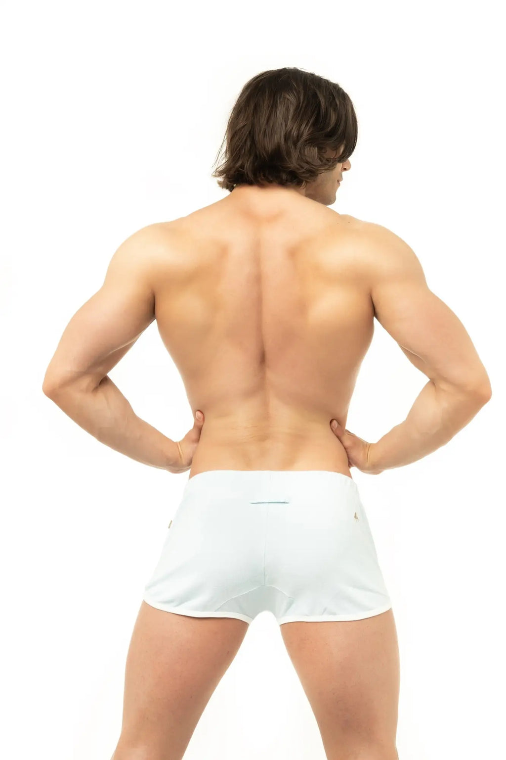 White Marcuse sweat shorts with a sleek form-fitting design and subtle side seams for athletic wear