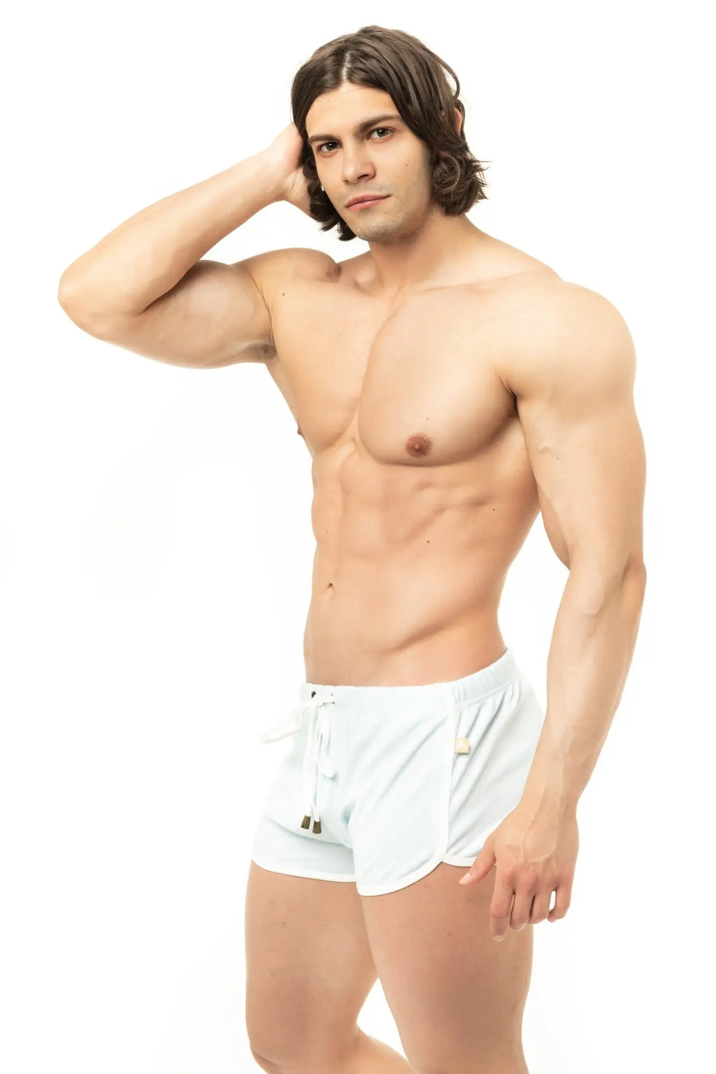 White Marcuse sweat shorts with drawstring waistband and subtle side pockets for athletic wear