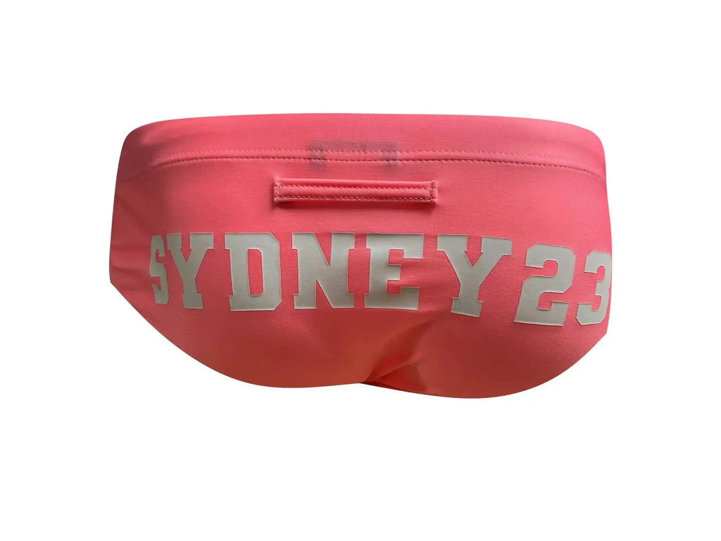 Pink marcuse syd23 bikini swimwear with silver sydney 23 lettering across the front of swim trunks