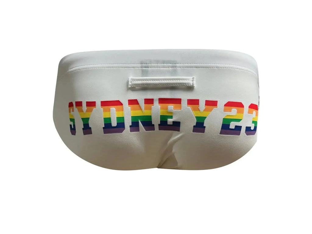 White marcuse syd23 bikini swimwear featuring swim trunks with sydney 23 in rainbow lettering across the front