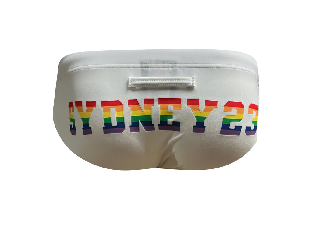 White marcuse syd23 bikini swimwear featuring swim trunks with sydney 23 in rainbow lettering across the front