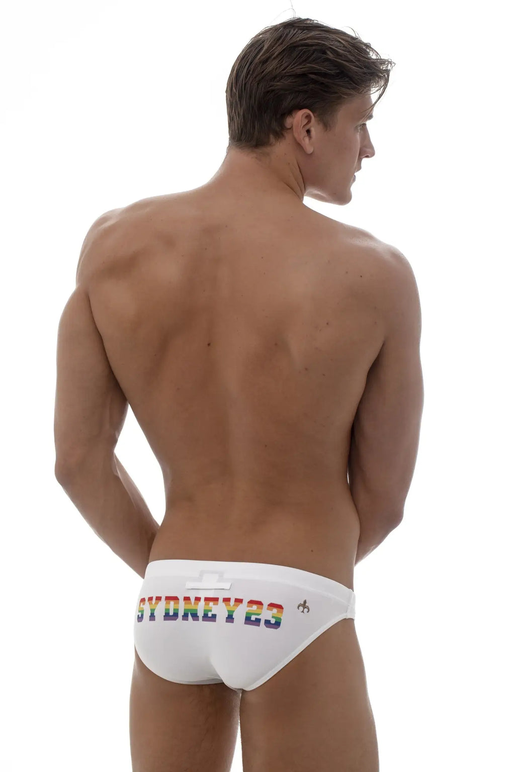 White marcuse syd23 bikini swimwear trunks with rainbow sydney2023 lettering on the waistband