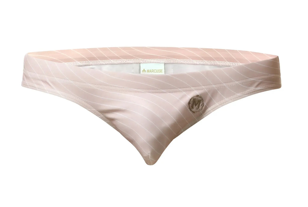 A blush pink satin bikini bottom with subtle diagonal stripes and an embroidered logo from Marcuse Tasman swimwear