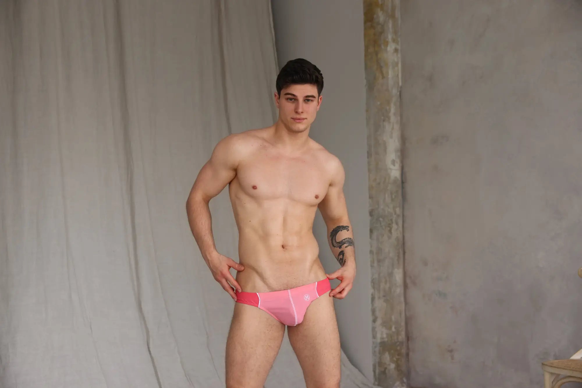 Marcuse Tropez bikini swimwear pink athletic briefs with subtle white logo on left hipband for swim use