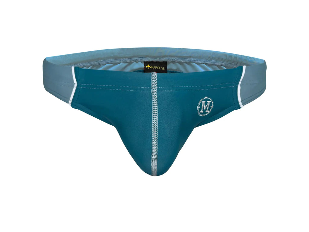 Teal and gray Marcuse Tropez bikini swimwear men’s swim trunks with white stitching and branded logo
