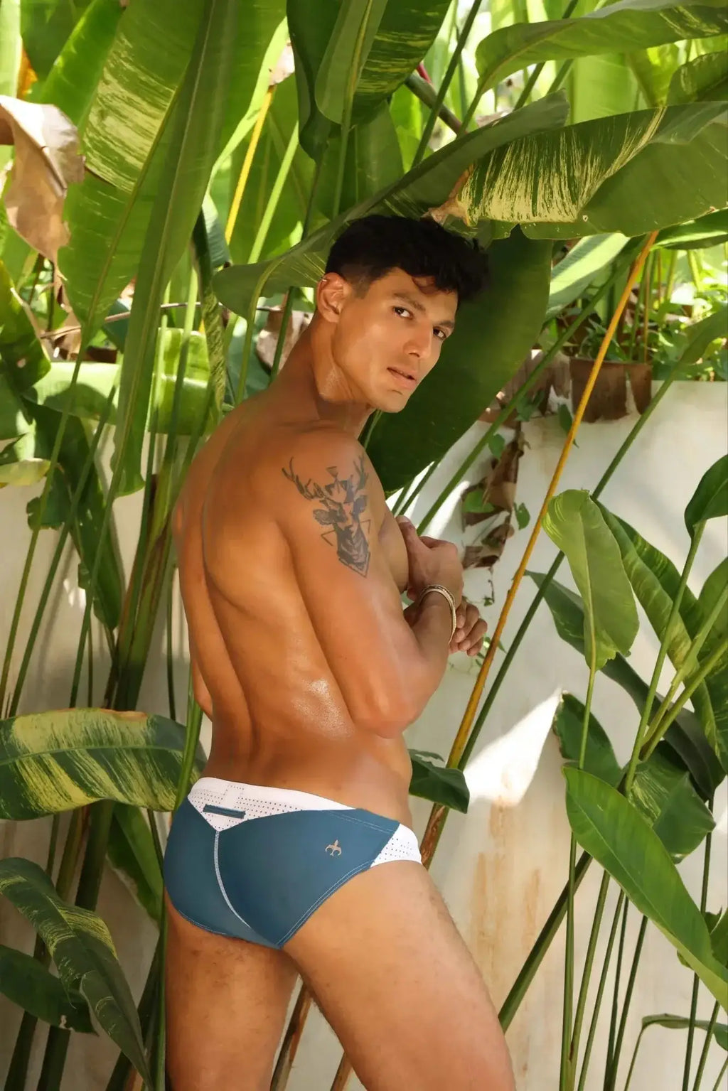 Marcuse Umbra bikini swimwear in blue and white athletic briefs with a mesh panel at the waistband
