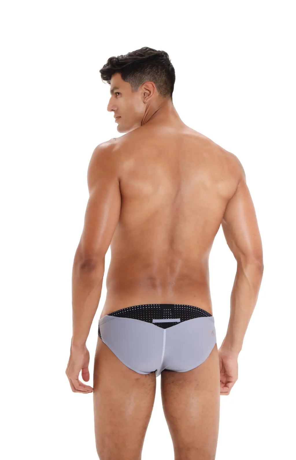Gray Marcuse Umbra bikini swimwear trunks with a black perforated waistband designed for swimming and beachwear