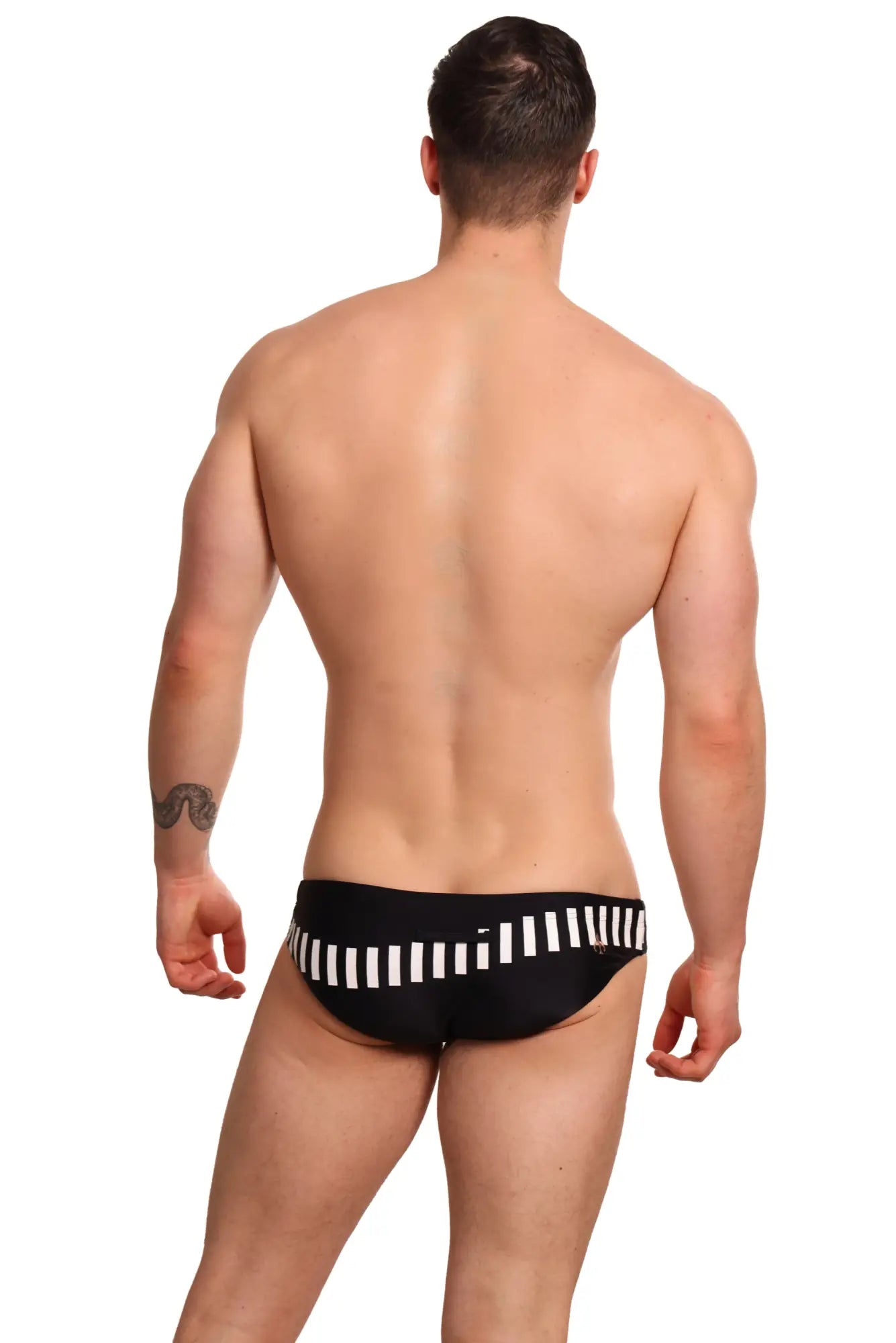 Black marcuse verve bikini swimwear trunks with bold white vertical stripe pattern across the waistband
