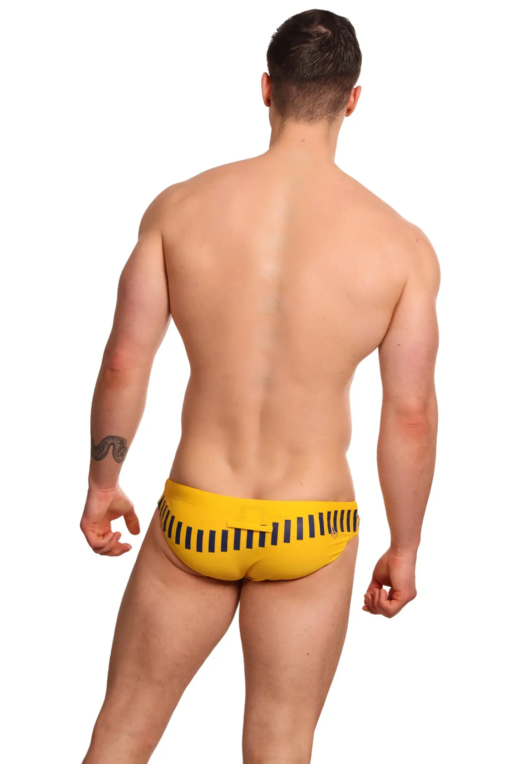 Bright yellow marcuse verve bikini swimwear swim trunks with bold black vertical stripes on the back side