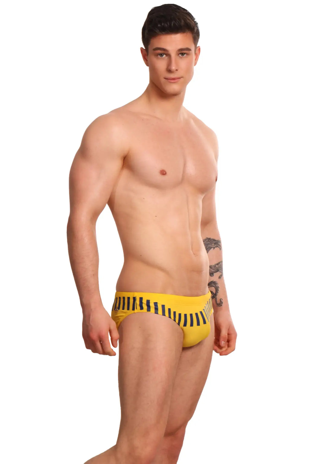 Yellow swim trunks with black vertical stripes from marcuse verve bikini swimwear designed for beachwear
