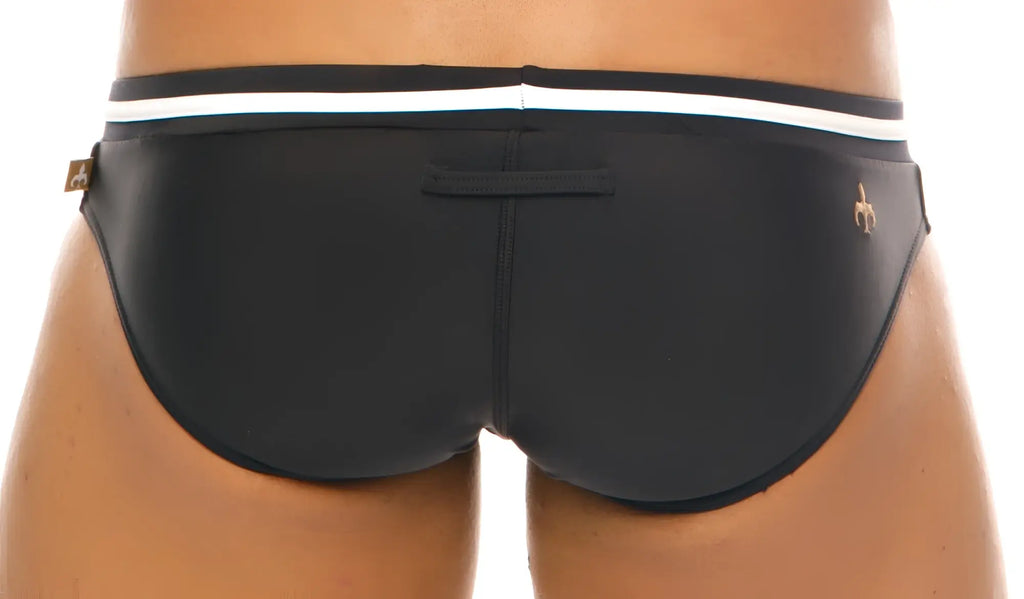 Black marcuse volie bikini swimwear trunks with white waistband stripe and gold-tone branding on the side
