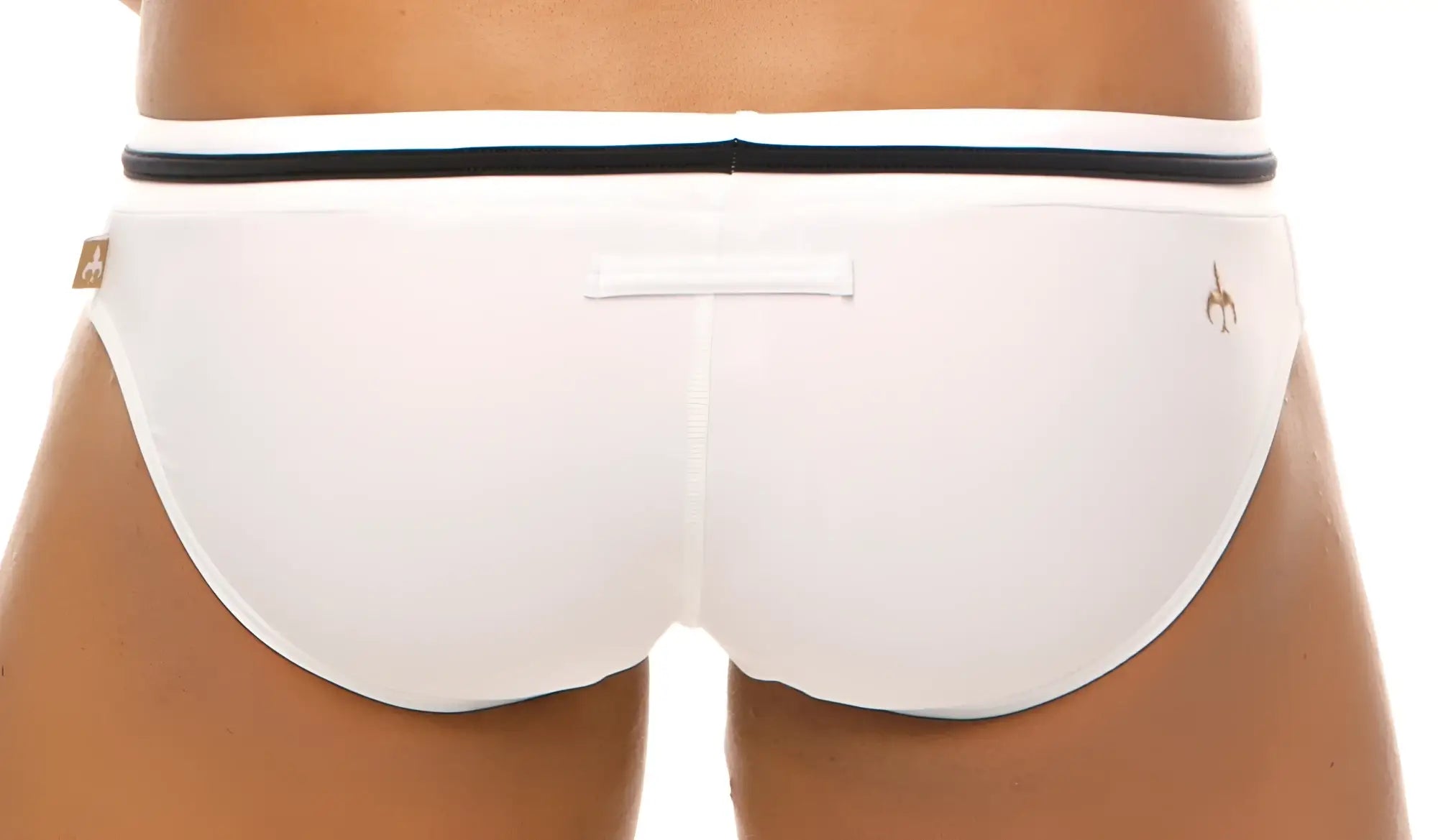 White marcuse volie bikini swimwear trunks with black waistband and small gold logo on the side