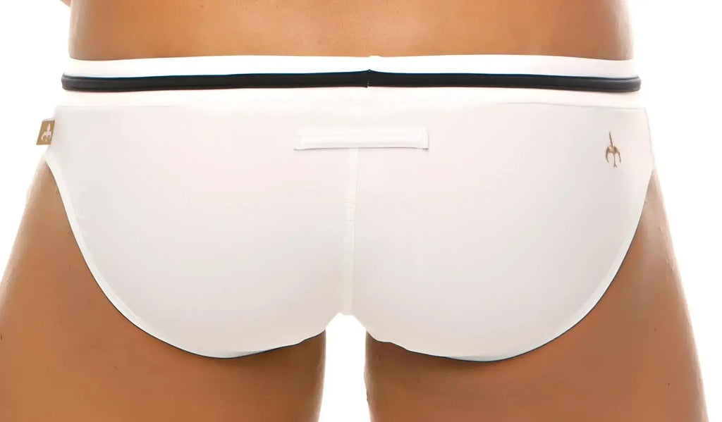 White marcuse volie bikini swimwear trunks with black waistband and small gold logo on the side