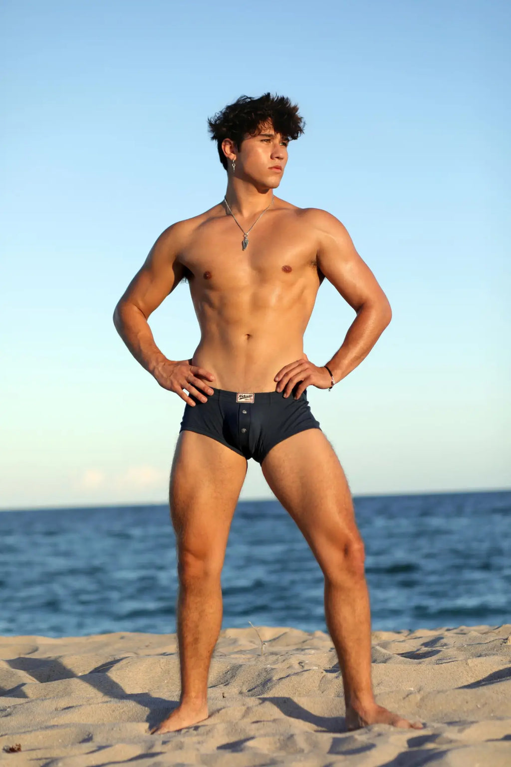 Dark blue marcuse waterboy boxer briefs with a small rectangular logo on the waistband